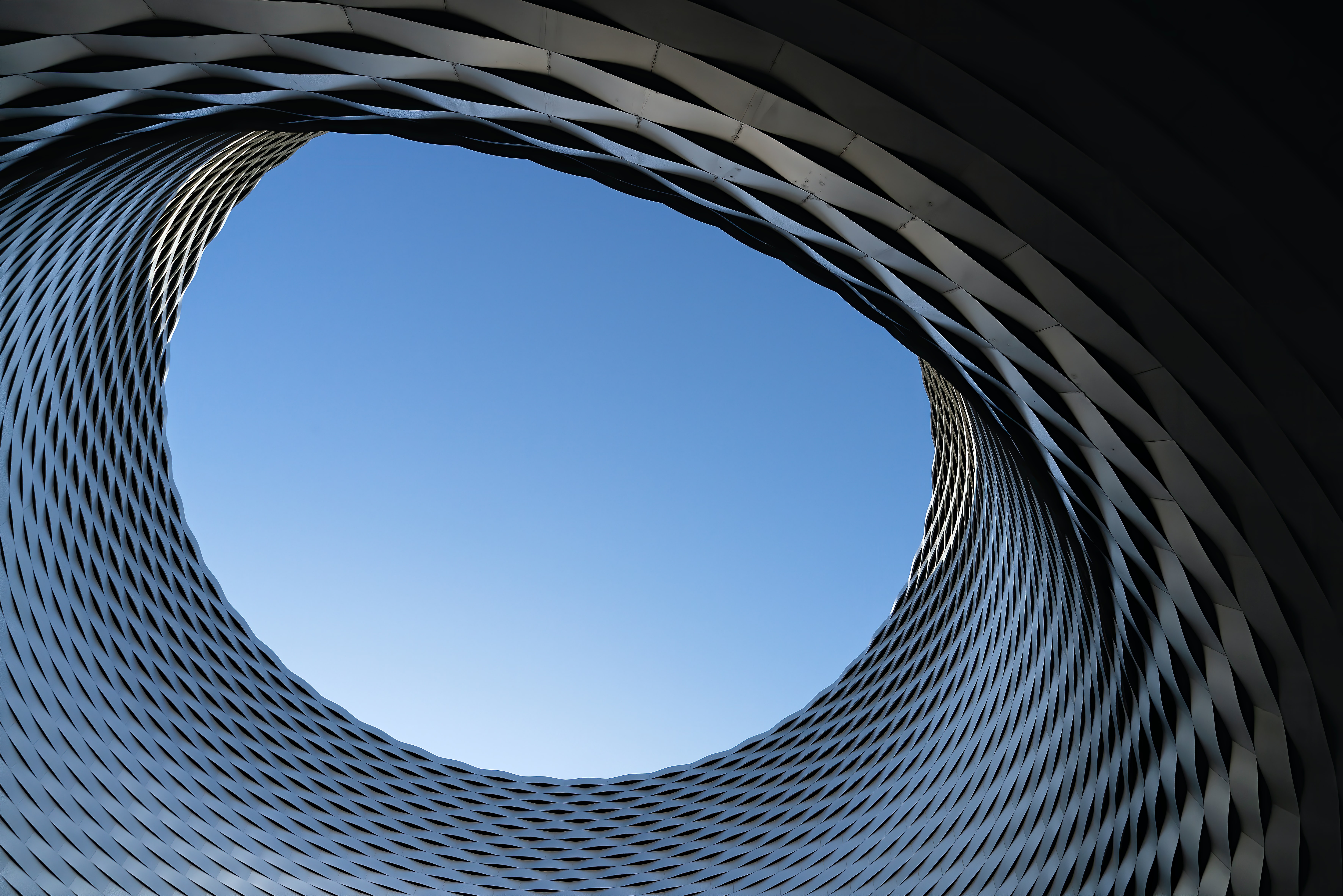 Blue sky surrounded by latice-work
